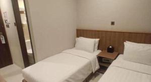 Uma cama ou camas num quarto em WE Hotel Kowloon