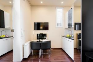 Kuchyň nebo kuchyňský kout v ubytování Little Boss Apartment
