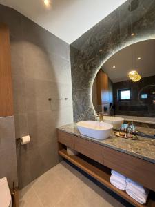 a bathroom with a sink and a mirror at Pansion Katarina Krk in Malinska +56 photos