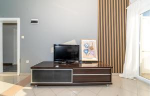 a living room with a television on a table at 1 Bedroom Amazing Apartment In Krusevo in Kruševo