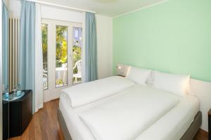 Postelja oz. postelje v sobi nastanitve Hotel Garni dei fiori