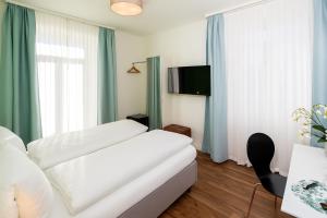 Postelja oz. postelje v sobi nastanitve Hotel Garni dei fiori