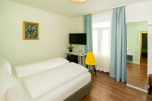 Postelja oz. postelje v sobi nastanitve Hotel Garni dei fiori