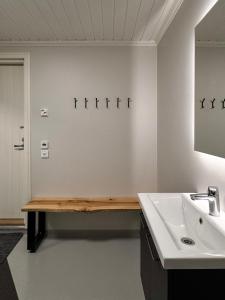 a bathroom with a sink and a mirror at Luxury Villa in Southern Finland in Lohja +57 photos