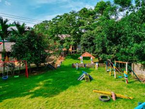 a group of playground equipment in a yard at Chiềng Farm Homestay Hoà Bình in Cao Phong