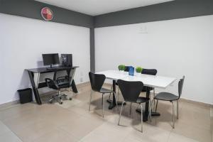 a meeting room with a white table and chairs at Days Inn by Wyndham Minatitlan in Minatitlán