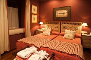 Säng eller sängar i ett rum på Hotel El Ciervo