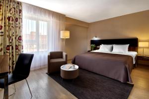 Posteľ alebo postele v izbe v ubytovaní Hotel Moderno Poznań