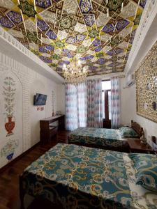 Кровать или кровати в номере Hotel Gulnaraxanum Boutique This hotel is nearby the center of the old city Every room decorated in the unique style