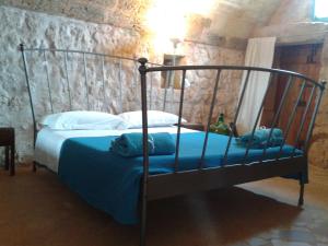 Un pat sau paturi într-o cameră la Trullo Nicola