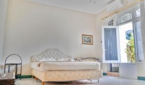 Et opholdsområde på Homestay Heru + 8 billeder