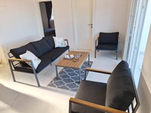 a living room with a couch and a table at Apartmani Jerka in Vinišće