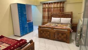 a bedroom with two beds in a room at Himaliya Inn Hotel & Restaurant in Mināwar