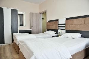 Ένα ή περισσότερα κρεβάτια σε δωμάτιο στο altın otel +18 φωτογραφίες
