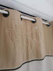 a curtain with a drawing of a mountain on it at Il Vialetto in Elmas