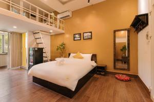 Postel nebo postele na pokoji v ubytování Oh Trendy Homes Hoan Kiem LTT