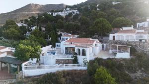 a house on a hill with white houses at NEW villa - luxury, views, hot tub, pool, 8 plus sofabed in Cómpeta