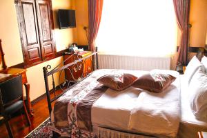 Postel nebo postele na pokoji v ubytování Aksehir Butik Hotel