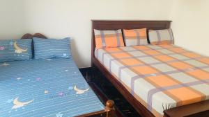 Postel nebo postele na pokoji v ubytování Induwara Holiday home