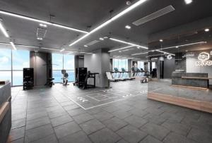 a large room with a gym with chairs in it at Panorama Nha Trang Sunlight Apartment in Nha Trang