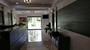 a kitchen with a couch and a plant in a room at Baggak Hotel & Restaurant by SMS Hospitality in Sanchez-Mira