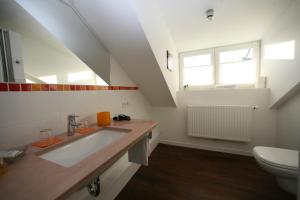 a bathroom with a sink and a toilet at Hotel Gutenberg in Westerland (Sylt)