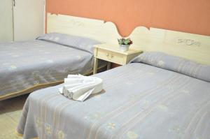 Letto o letti in una camera di Hotel Metropolitan I