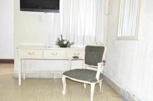 TV a/nebo společenská místnost v ubytování Hotel Metropolitan I + 12 fotografií