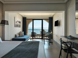 A bed or beds in a room at Aeolos Beach Resort