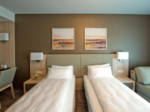 Hotel Molo Resort客房内的一张或多张床位