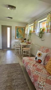 a living room with a couch and a table at Apartmán Karovi in Deštné v Orlických horách