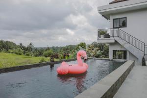 Bazén v ubytování Sunset Villas Bungalow Ubud nebo v jeho okolí