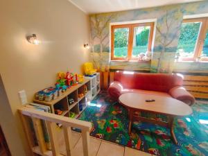 a living room with a couch and a table at Willa Jasiu in Władysławowo +102 photos