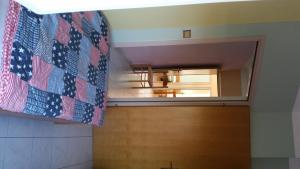 a hallway with a wooden door and a mirror at Apartments Drago in Petrcane +59 photos