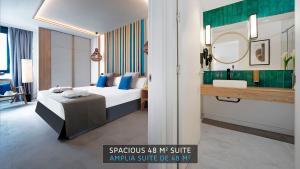a hotel room with a bed and a sink at HOVIMA Suites Costa Adeje in Adeje