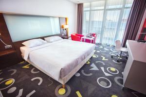 Posteľ alebo postele v izbe v ubytovaní Park Inn by Radisson Sarvar Resort & Spa - All Inclusive