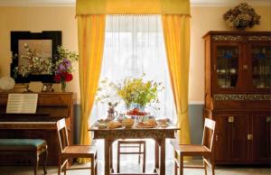 a table with food on it in front of a window at Iride Bed and Breakfast in Baronissi
