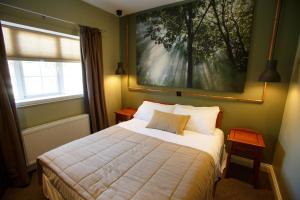 Letto o letti in una camera di Giltraps Townhouse & Glamping