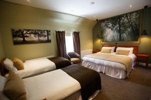 Letto o letti in una camera di Giltraps Townhouse & Glamping