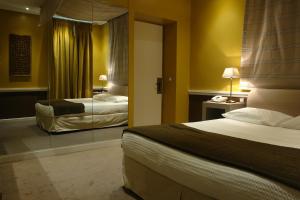 Postel nebo postele na pokoji v ubytování Semeli Hotel