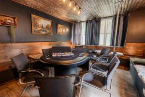 a room with a table and chairs and a laptop at Rheinsteig Chalét Bendorf in Bendorf