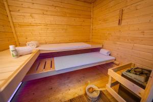 an empty wooden sauna with two beds in it at Rheinsteig Chalét Bendorf in Bendorf