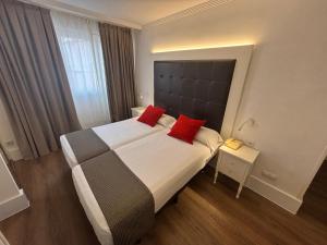 Postel nebo postele na pokoji v ubytování Hotel Boutique Catedral