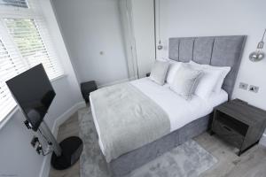 Giường trong phòng chung tại Bell House Oxford - The Punt