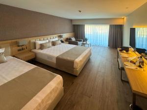 Ένα ή περισσότερα κρεβάτια σε δωμάτιο στο Luna Vista Hotel Belek +155 φωτογραφίες