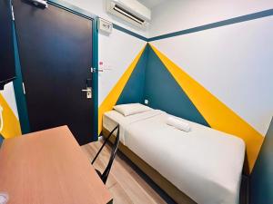 Postel nebo postele na pokoji v ubytování Smile Hotel Subang Airport