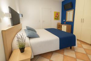 Postel nebo postele na pokoji v ubytování Hotel Aldebaran + 23 fotografií