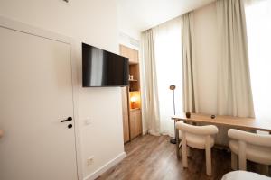 TV a/nebo společenská místnost v ubytování Memory-Making Hotel Vienna