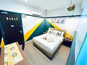 Postel nebo postele na pokoji v ubytování Smile Hotel Subang Airport