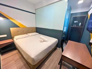 Postel nebo postele na pokoji v ubytování Smile Hotel Subang Airport